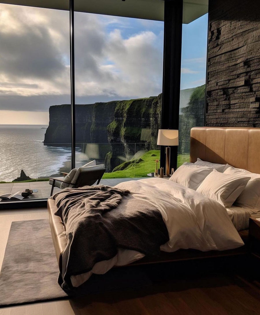 master bedroom overlooking coastal waters with small lamp in corner