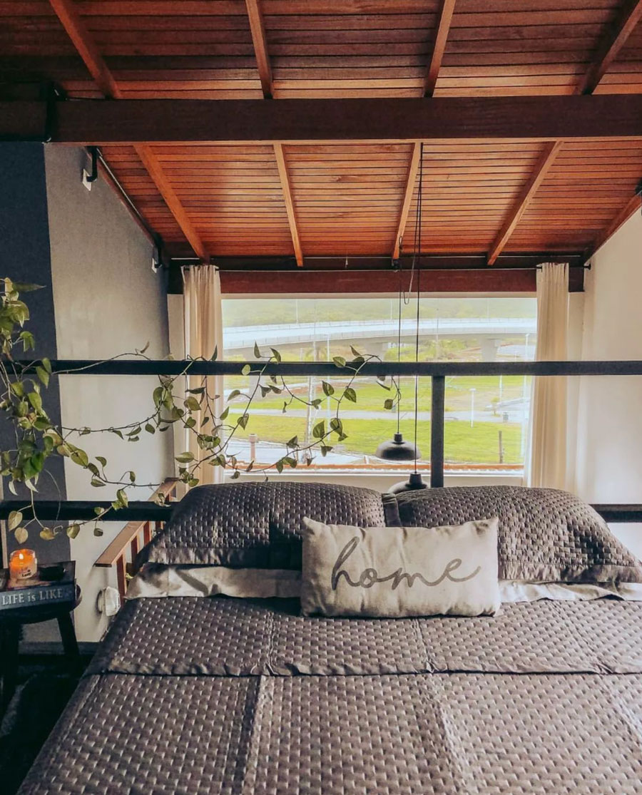 small bed space overlooking living room