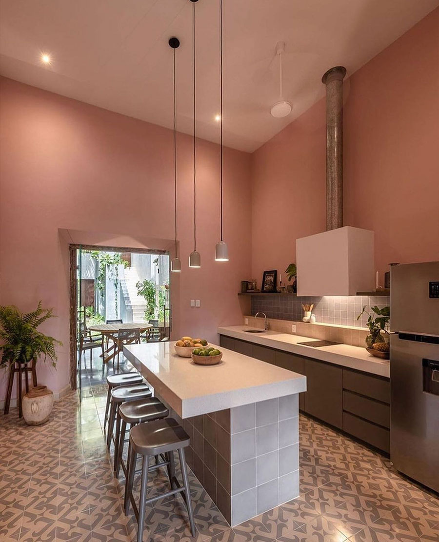 pink kitchen, stone island with bar chairs