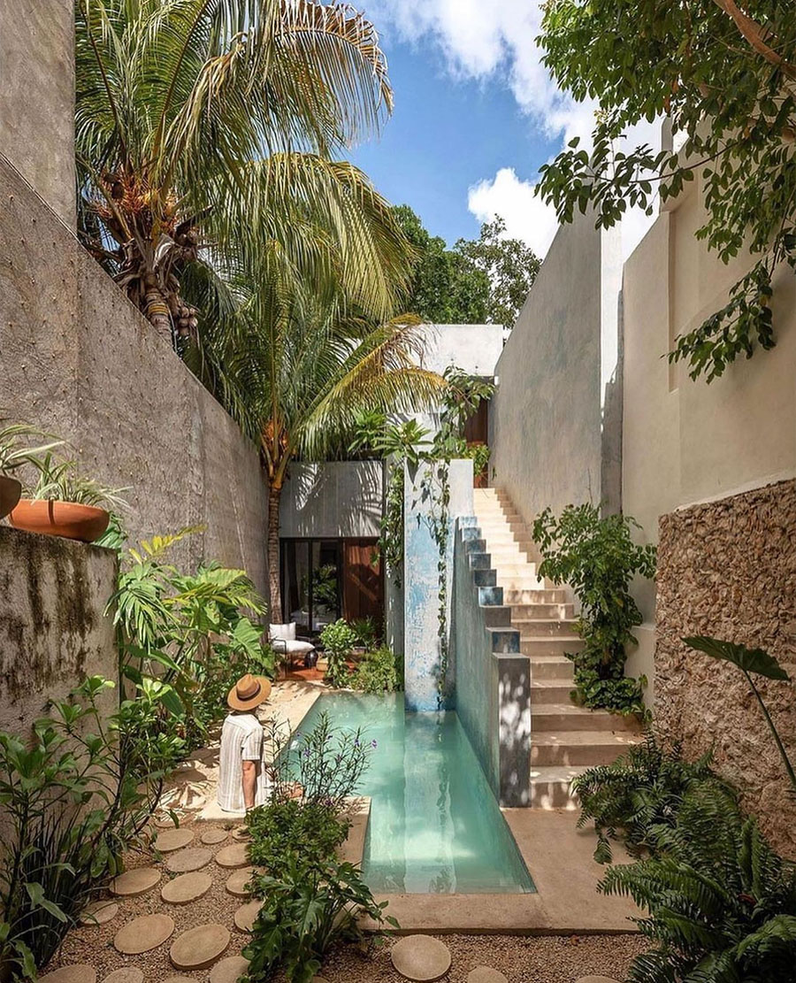 Man sitting next to pool, outdoor views