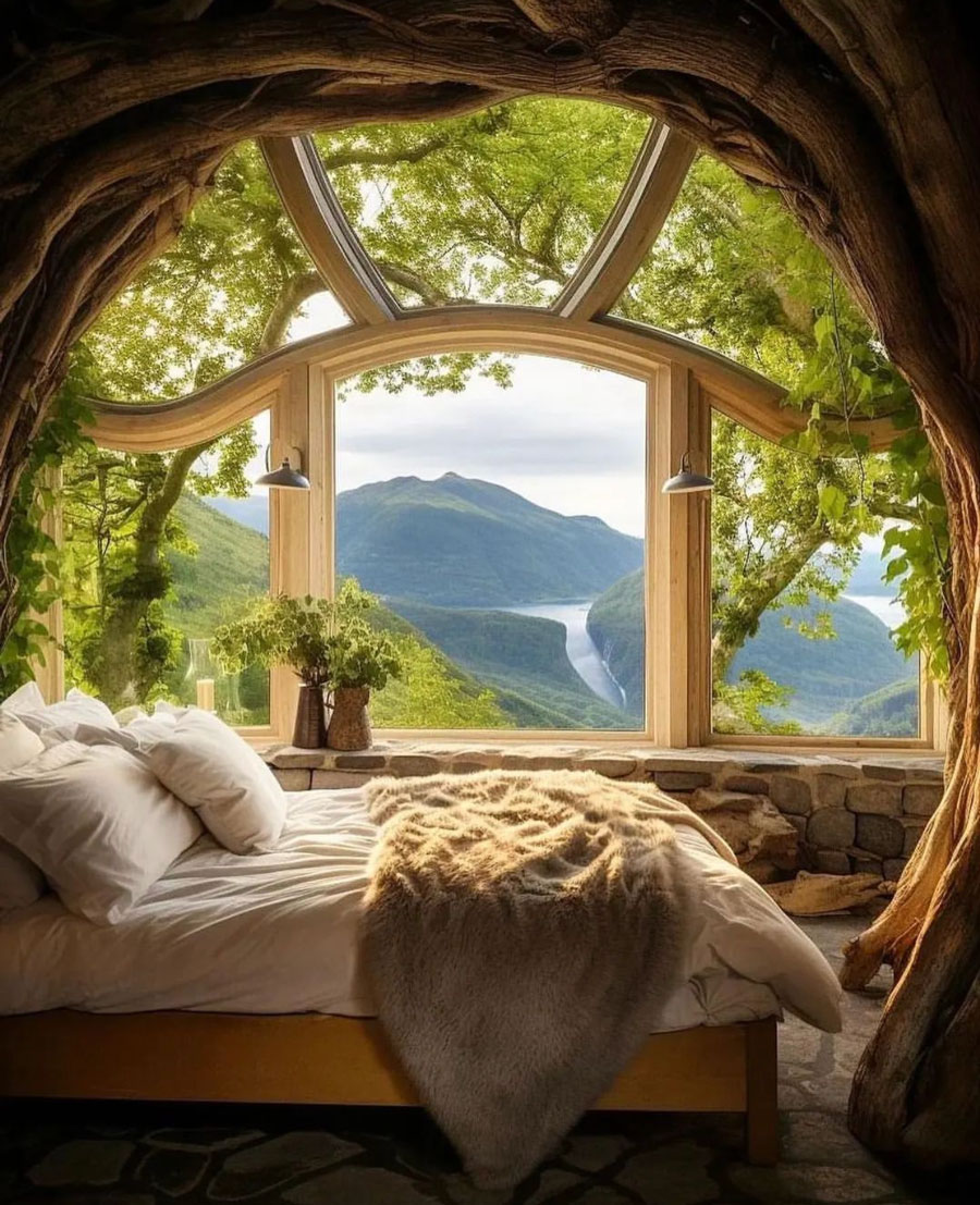 small bedroom with wide open window in tree house