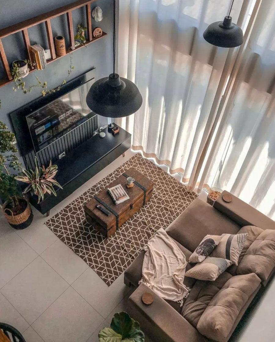 high angle living room view, brown carpet, long curtains 